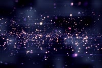 Purple bright glittering light circles on dark background